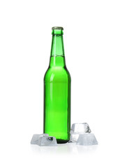 Bottle of beer and ice cubes on white background