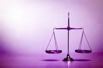 Law scales on table background. Symbol of justice