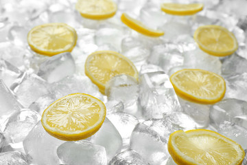 Fresh lemon slices on pile of ice cubes