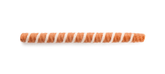 Delicious chocolate wafer roll on white background, top view. Sweet food