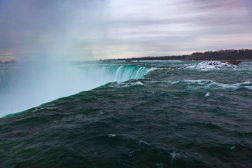 Niagara Falls CANADA - February 23, 2019: Winter frozen idyll at Horseshoe Falls, the Canadian side of Niagara Falls, view showing as well as the upper Niagara River