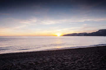 Obraz premium sunset on the beach in almunecar spain