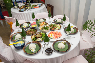 Tradition Northern Thai food. on a wooden table, Set of Thai food popular menu. radition lunch or dinner.Thai food concept Spicy Paste Dip Nam Prik Asian style banquet.Thai traditional Kantoke set.