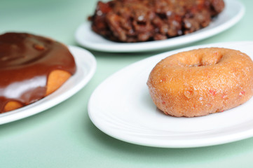 Variety of Breakfast Pastry Food - Donut, Fritter & Cinnamon Bun