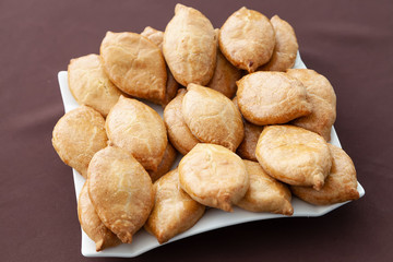 Russian baked pies on a white plate