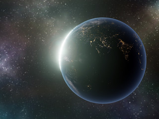 Earth globe with rising Sun