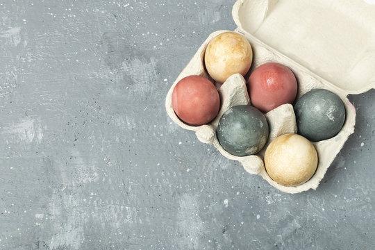 Naturally dyed easter eggs in cardboard container