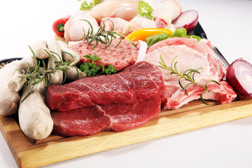 raw meat. Different types of raw pork meat, chicken and beef with spices and herbs