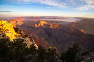 Sunrise Image of the Grand Canyon National Park with early morning haze and fog, Arizona, USA