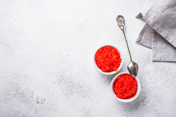 Two bowls with red salmon caviar