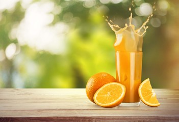 Naklejka premium Orange Juice in glass on background.