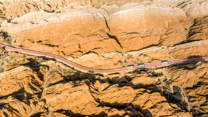 Tourist Buses in Rainbow Mountains Zhangye Danxia Landform Geological Park in China and Road.