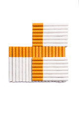 Cigarettes in cross shape form. Conceptual image of a no smoking idea isolated on white.