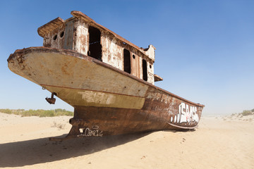 Rustic boats on a ship graveyards on a desert around Moynaq, Muynak or Moynoq - Aral sea or Aral...