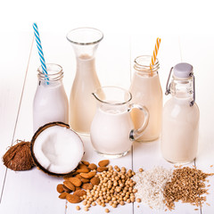 Various types of all-vegetable and organic milk in glass containers