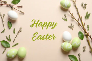 Flat lay composition with painted eggs and text Happy Easter on color background