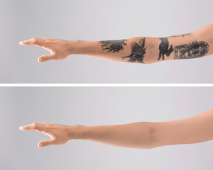Man's arm with stylish tattoos on grey background