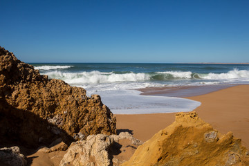 Rocks on the sandy beach, Lalla Fatna, Morocco