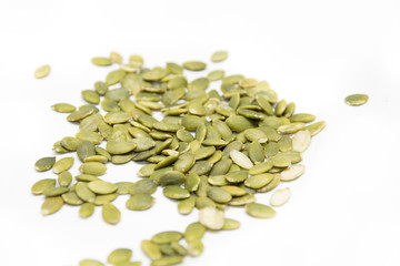 Green pumpkin seed isolated on white background.