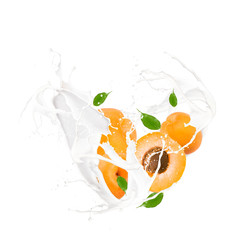 Milk splash with apricot isolated on white background.