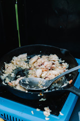 Close up of lobster meat cooking in a frying pan