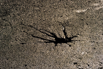 Hole in ice by stone on Rozmberk pond in south Bohemia