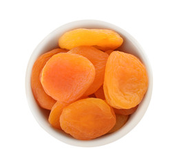 Bowl with apricots on white background, top view. Dried fruit as healthy food
