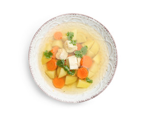 Dish with fresh homemade chicken soup on white background, top view
