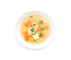 Dish with fresh homemade chicken soup on white background, top view