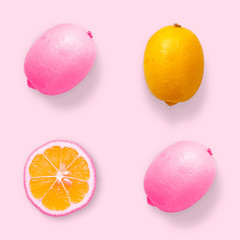A minimalist design with a dyed pink lemon. Creative summer concept. Creative summer concept. Flat lay.Top view.