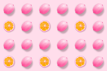 Creative seamless pattern of lemons. Minimal summer concept.  Lemon on pastel pink background. Flat lay.Top view.