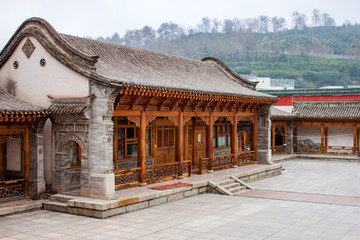 Traditional Stone, Brick And Wooden Chinese Architecture Of The Rich House.