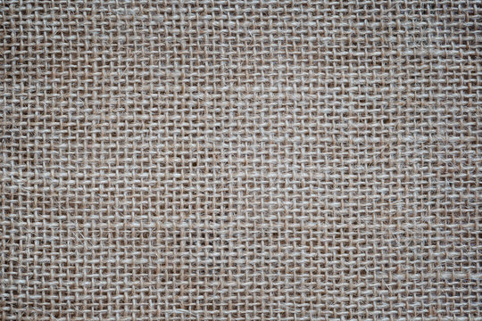 Close-up of a burlap jute canvas full frame background with vignetting.