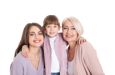 Portrait of beautiful mature woman with daughter and grandchild on white background