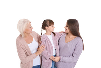 Portrait of beautiful mature woman with daughter and grandchild on white background