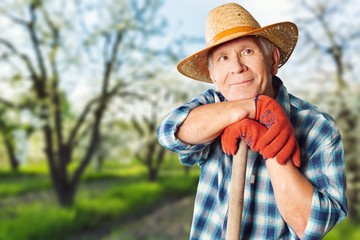 Fototapeta premium Thoughtful senior man with glasses outdoors