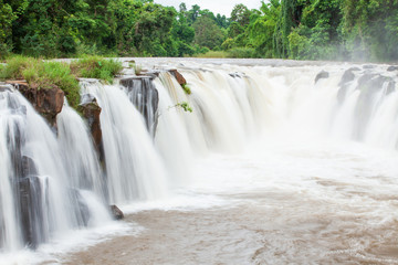 Gently Tad Pha Suam waterfall on rain morning.