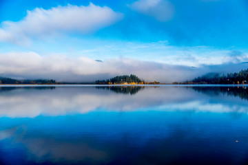 Lake in autumn fog