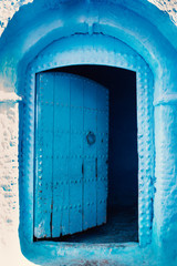 Chefchaouen - blue city of Morocco. Detail on a blue doors and walls. Blue town street.
