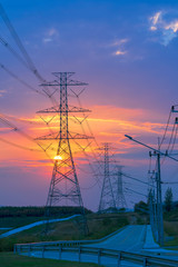 High voltage electricity post and colorful sky on sunrise