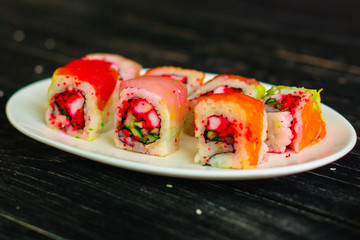 rolls and sushi set, mix different tastes. food background. top