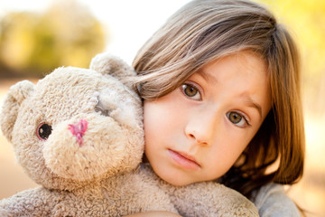 Little Girl Holding Ragged Teddybear Outside - Poverty, Runaway Children