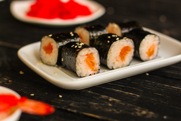 rolls and sushi set, mix different tastes. food background. top
