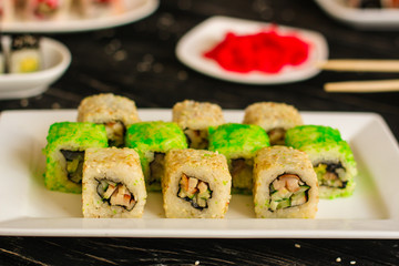 rolls and sushi set, mix different tastes. food background. top