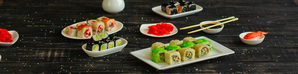 rolls and sushi set, mix different tastes. food background. top