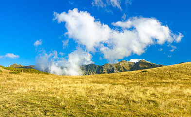 mountain landscape with blue sky and white clouds