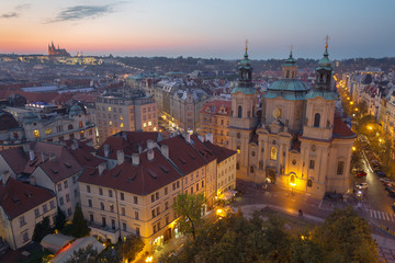 Prague - The panorama with the St. Nicholas church,   Staromestske square and the Old Town at dusk..