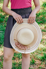 girl with a hat in the park