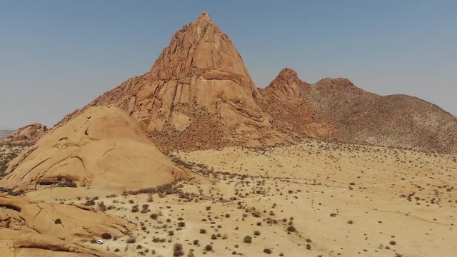 Arid desert landscape of Spitzkoppe mountain in Central Namibia, Aerial drone shot