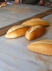 hot breads, oven and bread, freshly baked bread, baker bakes bread,